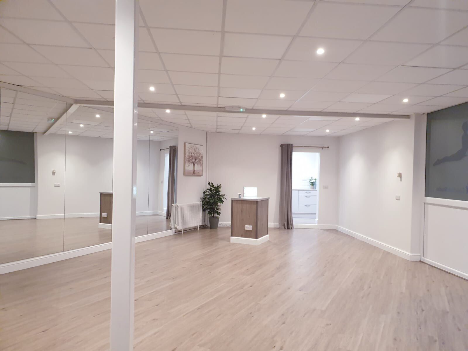 Commercial unit refitted with wood-effect flooring and new lighting